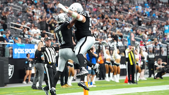 Sep 22, 2024; Paradise, Nevada, USA; Las Vegas Raiders wide receiver Tre Tucker (11) celebrates with Las Vegas Raiders guard Jackson Powers-Johnson (58) after scoring a touchdown against the Carolina Panthers during the fourth quarter at Allegiant Stadium. Mandatory Credit: Stephen R. Sylvanie-Imagn Images Sep 22, 2024; Paradise, Nevada, USA; Las Vegas Raiders wide receiver Tre Tucker (11) celebrates with Las Vegas Raiders guard Jackson Powers-Johnson (58) after scoring a touchdown against the Carolina Panthers during the fourth quarter at Allegiant Stadium. Mandatory Credit: Stephen R. Sylvanie-Imagn Images