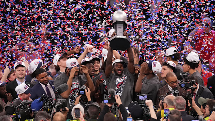 St. John’s players celebrate after winning the men’s Big East tournament championship game over UConn.