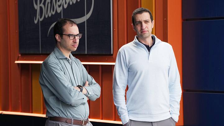 Feb 11, 2026; Port St. Lucie, FL, USA;  (left to right) Ben Zauzmer, Mets Assistant General Manager and David Stearns, Mets President, Baseball Operations, watch pitchers warm-up during spring training. Mandatory Credit: Jim Rassol-Imagn Images