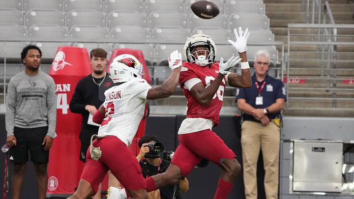 Arizona Cardinals receiver Jalen Brooks (86) catches a pass over cornerback Will Johnson (2) during training camp at State Farm Stadium in Glendale on Aug. 3, 2026. Arizona Cardinals receiver Jalen Brooks (86) catches a pass over cornerback Will Johnson (2) during training camp at State Farm Stadium in Glendale on Aug. 3, 2026.