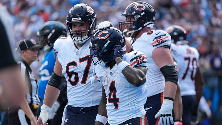 Chicago Bears center Garrett Bradbury (67) reacts to a touchdown scored by running back D'Andre Swift (4) in the first quarter against the Carolina Panthers at Bank of America Stadium. Mandatory Credit: Jim Dedmon-Imagn Images Chicago Bears center Garrett Bradbury (67) reacts to a touchdown scored by running back D'Andre Swift (4) in the first quarter against the Carolina Panthers at Bank of America Stadium. Mandatory Credit: Jim Dedmon-Imagn Images