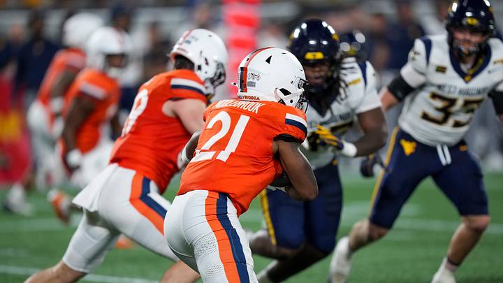 Sep 19, 2026; Charlotte, North Carolina, USA; Virginia Cavaliers running back Jekail Middlebrook (21) charges at West Virginia defenders. Mandatory Credit: Jim Dedmon-Imagn Images Sep 19, 2026; Charlotte, North Carolina, USA; Virginia Cavaliers running back Jekail Middlebrook (21) charges at West Virginia defenders. Mandatory Credit: Jim Dedmon-Imagn Images