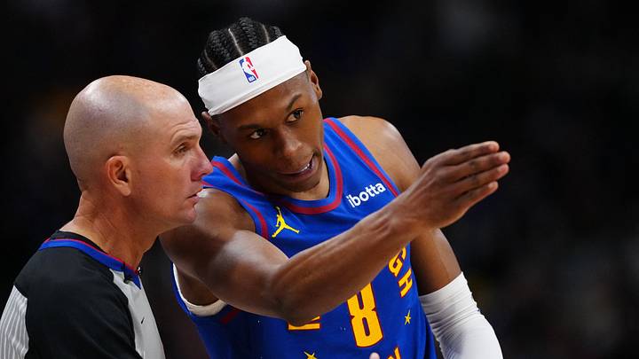 Mar 22, 2026; Denver, Colorado, USA; Denver Nuggets guard Peyton Watson (8) talks to referee Jacyn Goble (68) in the second half against the Portland Trail Blazers at Ball Arena. Mandatory Credit: Ron Chenoy-Imagn Images