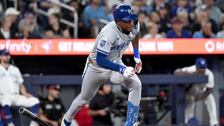 Aug 25, 2026; Toronto, Ontario, CAN;  Kansas City Royals second baseman Tyler Tolbert (2) hits a single against the Toronto Blue Jays in the ninth inning at Rogers Centre.  Mandatory Credit: Dan Hamilton-Imagn Images
