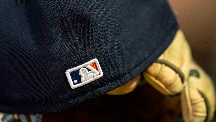 A general view of a Detroit Tigers hat with the Major League Baseball logo sitting in the dugout.  Credit: Jesse Johnson-Imagn Images