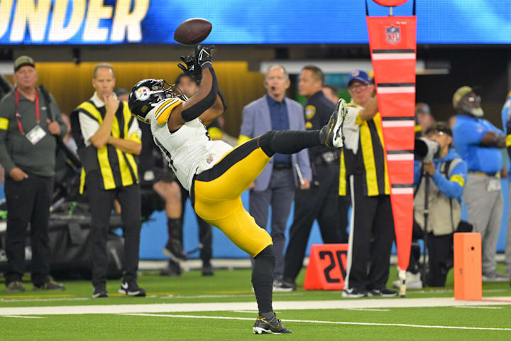 Football player dives for bal Football player dives for bal