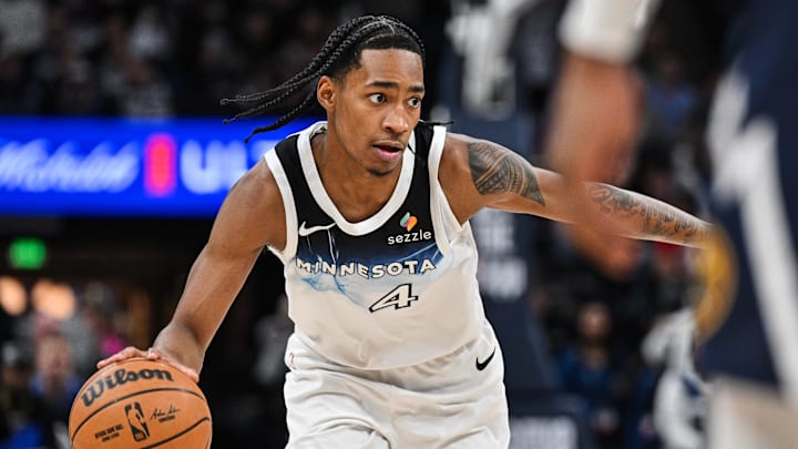 Jan 25, 2025; Minneapolis, Minnesota, USA; Minnesota Timberwolves guard Rob Dillingham (4) controls the ball against the Denver Nuggets during the fourth quarter at Target Center. Mandatory Credit: Jeffrey Becker-Imagn Images
