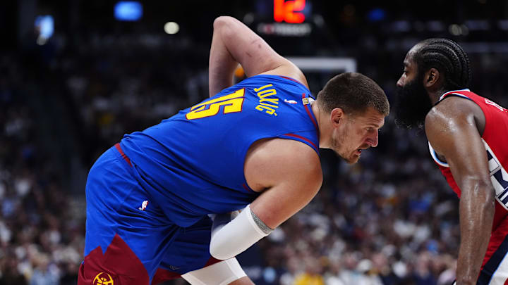 May 3, 2025; Denver, Colorado, USA; LA Clippers guard James Harden (1) defends on Denver Nuggets center Nikola Jokic (15) in the third quarter during game seven of first round for the 2025 NBA Playoffs at Ball Arena. Mandatory Credit: Ron Chenoy-Imagn Images