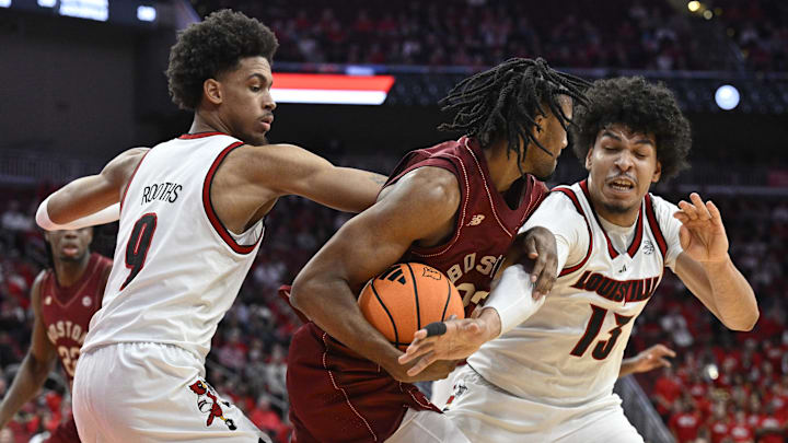 Jan 10, 2026; Louisville, Kentucky, USA; Louisville Cardinals forward Sananda Fru (13) and forward Khani Rooths (9) double team Boston College Eagles guard Aidan Shaw (23) during the first half at KFC Yum! Center. Mandatory Credit: Jamie Rhodes-Imagn Images Jan 10, 2026; Louisville, Kentucky, USA; Louisville Cardinals forward Sananda Fru (13) and forward Khani Rooths (9) double team Boston College Eagles guard Aidan Shaw (23) during the first half at KFC Yum! Center. Mandatory Credit: Jamie Rhodes-Imagn Images