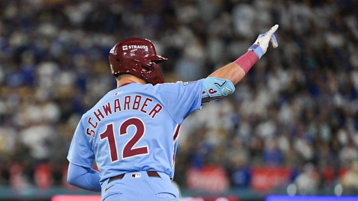 Oct 8, 2025; Los Angeles, California, USA; Philadelphia Phillies designated hitter Kyle Schwarber (12) celebrates after hitting a solo home run during the fourth inning against the Los Angeles Dodgers during game three of the NLDS round for the 2025 MLB playoffs at Dodger Stadium. Mandatory Credit: Jayne Kamin-Oncea-Imagn Images Oct 8, 2025; Los Angeles, California, USA; Philadelphia Phillies designated hitter Kyle Schwarber (12) celebrates after hitting a solo home run during the fourth inning against the Los Angeles Dodgers during game three of the NLDS round for the 2025 MLB playoffs at Dodger Stadium. Mandatory Credit: Jayne Kamin-Oncea-Imagn Images