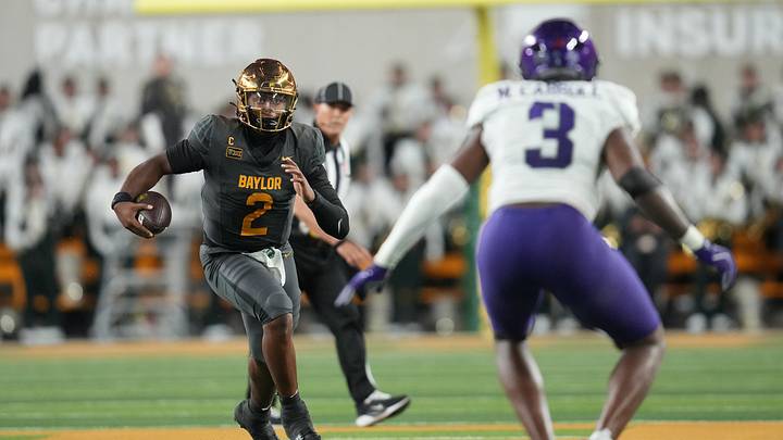 Oct 17, 2026; Waco, Texas, USA;  Baylor Bears quarterback DJ Lagway (2) runs with the ball as TCU Horned Frogs linebacker Max Carroll (3) defends during the first half at McLane Stadium.  Mandatory Credit: Chris Jones-Imagn Images