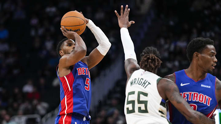 Nov 13, 2024; Milwaukee, Wisconsin, USA;  Detroit Pistons guard Malik Beasley (5) shoots against Milwaukee Bucks guard Delon Wright (55) during the third quarter at Fiserv Forum. Mandatory Credit: Jeff Hanisch-Imagn Images