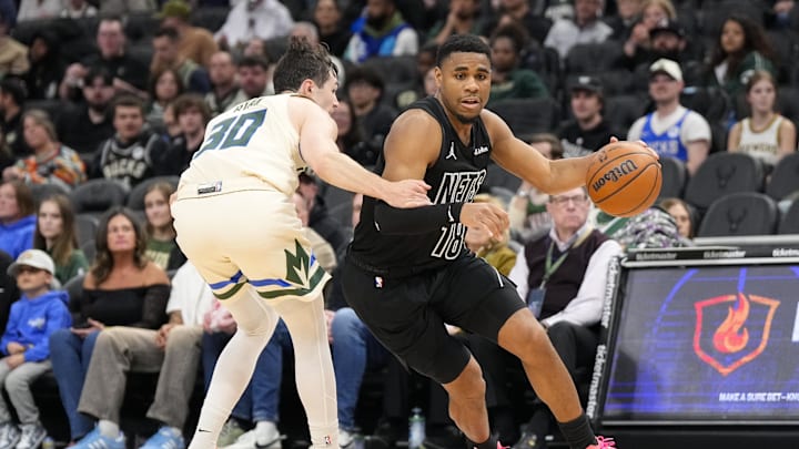 Apr 10, 2026; Milwaukee, Wisconsin, USA;  Brooklyn Nets guard Malachi Smith (18) drives towards the basket against Milwaukee Bucks guard Cormac Ryan (30) during the third quarter at Fiserv Forum. Mandatory Credit: Jeff Hanisch-Imagn Images