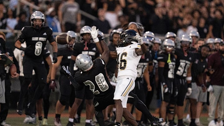St. Peter Prep's Abdul Turay (20) attempts to catch a pass while being guarded by Paramus Catholic's Divine Kirby (16) during a high school football game between St. Peter’s Prep and Paramus Catholic in Jersey City on Friday, Aug. 29, 2025.