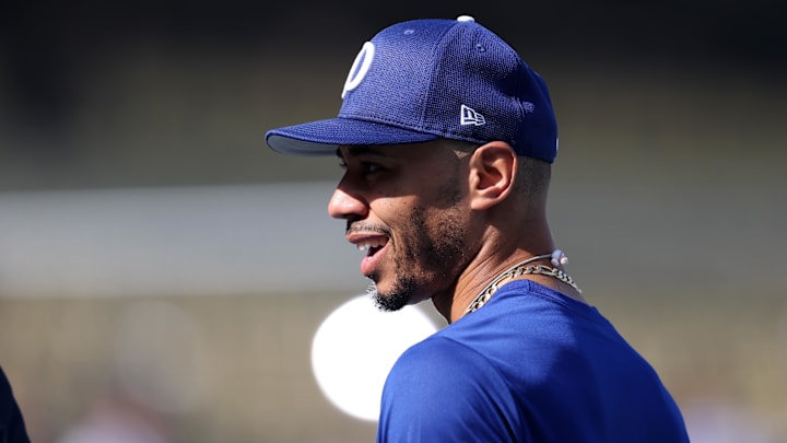 Oct 27, 2025; Los Angeles, California, USA; Los Angeles Dodgers shortstop Mookie Betts (50) warms up before game three of the 2025 MLB World Series against the Toronto Blue Jays at Dodger Stadium. Mandatory Credit: Kiyoshi Mio-Imagn Images
