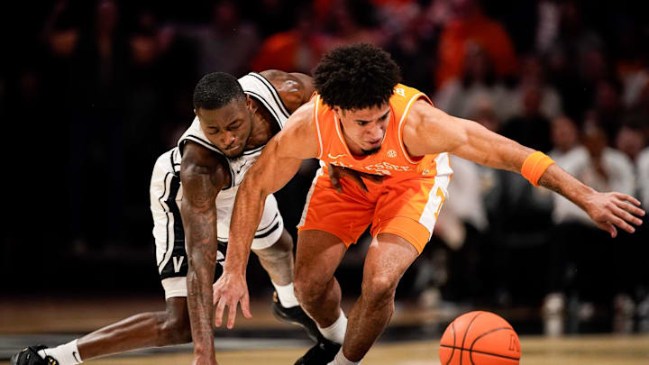 Tennessee guard Bishop Boswell (3) and Vanderbilt guard Duke Miles (2) chase a loose ball during the second half at Memorial Gym in Nashville, Tenn., Saturday, Feb. 21, 2026. Tennessee guard Bishop Boswell (3) and Vanderbilt guard Duke Miles (2) chase a loose ball during the second half at Memorial Gym in Nashville, Tenn., Saturday, Feb. 21, 2026.