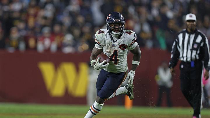Oct 13, 2025; Landover, Maryland, USA; Chicago Bears running back D'Andre Swift (4) runs with the ball against the Washington Commanders during the fourth quarter at Northwest Stadium. Mandatory Credit: Peter Casey-Imagn Images