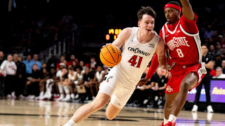 Cincinnati Bearcats guard-forward Simas Lukošius (41) handles the ball as Ohio State Buckeyes guard Micah Parrish (8) guards him in the first half of a basketball scrimmage between Cincinnati Bearcats and Ohio State Buckeyes at Fifth Third Arena in Cincinnati on Friday, Oct. 18, 2024. Cincinnati Bearcats guard-forward Simas Lukošius (41) handles the ball as Ohio State Buckeyes guard Micah Parrish (8) guards him in the first half of a basketball scrimmage between Cincinnati Bearcats and Ohio State Buckeyes at Fifth Third Arena in Cincinnati on Friday, Oct. 18, 2024.