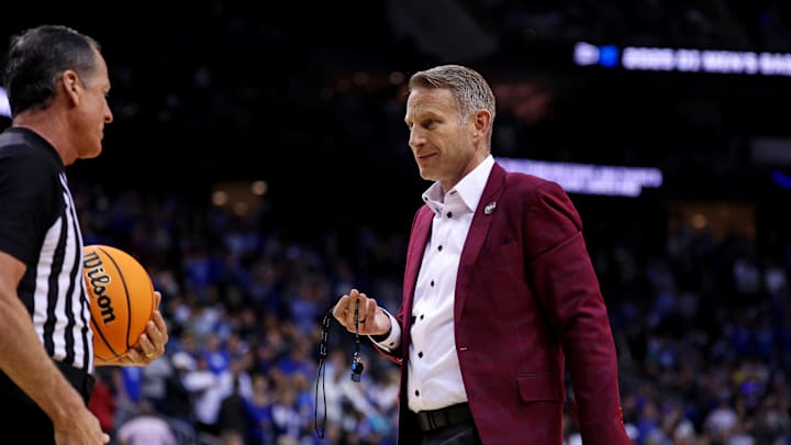 Mar 29, 2025; Newark, NJ, USA; Alabama Crimson Tide head coach Nate Oats brings a referee a whistle during the second half against the Duke Blue Devilsin the East Regional final of the 2025 NCAA tournament at Prudential Center. Mandatory Credit: Vincent Carchietta-Imagn Images