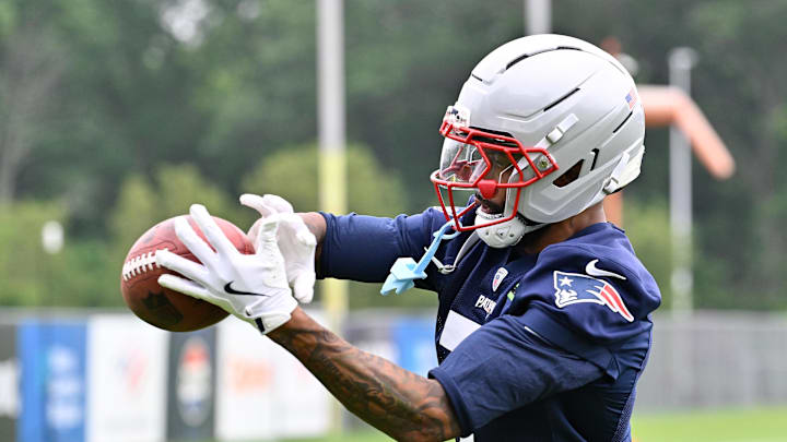 Jun 9, 2025; Foxborough, MA, USA; New England Patriots cornerback Carlton Davis III (7) makes a catch during minicamp at Gillette Stadium. Mandatory Credit: Eric Canha-Imagn Images