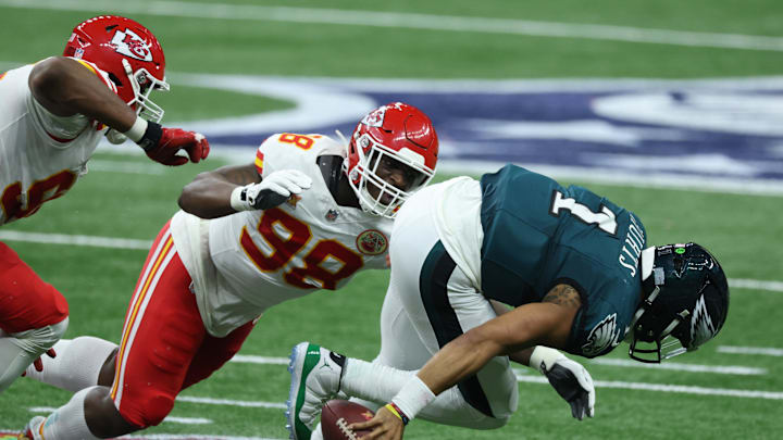 Feb 9, 2025; New Orleans, LA, USA; Philadelphia Eagles quarterback Jalen Hurts (1) is tackled by Kansas City Chiefs defensive tackle Tershawn Wharton (98) in the second quarter in Super Bowl LIX at Ceasars Superdome. Mandatory Credit: Stephen Lew-Imagn Images Feb 9, 2025; New Orleans, LA, USA; Philadelphia Eagles quarterback Jalen Hurts (1) is tackled by Kansas City Chiefs defensive tackle Tershawn Wharton (98) in the second quarter in Super Bowl LIX at Ceasars Superdome. Mandatory Credit: Stephen Lew-Imagn Images
