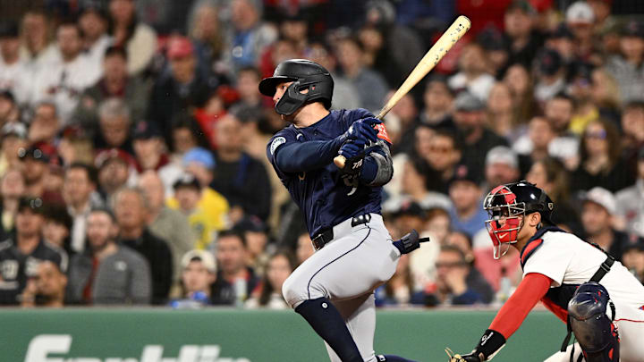 Seattle Mariners third base Ben Williamson (9) hits a RBI single against the Boston Red Sox during the seventh inning at Fenway Park on April 23.