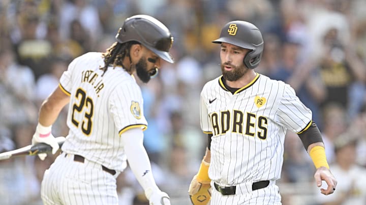 Sep 2, 2024; San Diego, California, USA; San Diego Padres shortstop Mason McCoy (18), right, is congratulated by  Fernando Tatis Jr. (23) after scoring during the third inning against the Detroit Tigers at Petco Park. Mandatory Credit: Denis Poroy-Imagn Images
