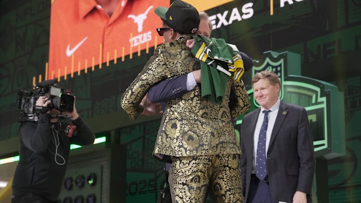 Receiver Matthew Golden of Texas hugs NFL Commissioner Roger Goodell after being selected by the Green Bay Packers.