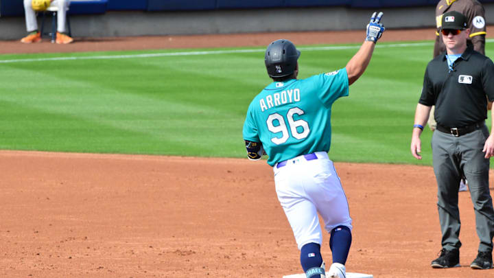Feb 20, 2026; Peoria, Arizona, USA; Seattle Mariners shortstop Michael Arroyo (96) hits a two run home run in the second inning against the San Diego Padres during a Spring Training game at Peoria Sports Complex. Mandatory Credit: Matt Kartozian-Imagn Images