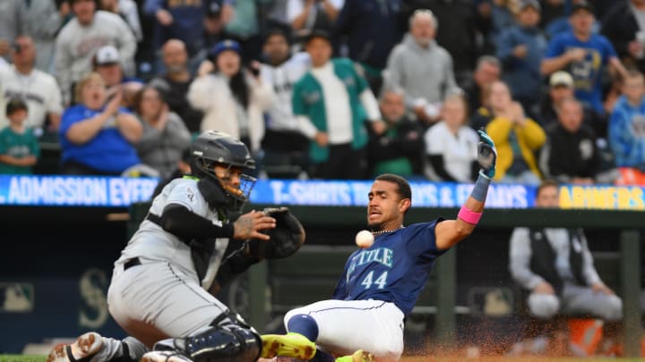 Seattle Mariners center fielder Julio Rodriguez (44) beats the throw to home plate to score a run against the Chicago White Sox during the seventh inning at T-Mobile Park June 11.