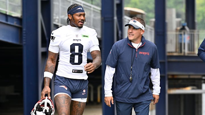 Jun 9, 2025; Foxborough, MA, USA; New England Patriots wide receiver Stefon Diggs (8) and offensive coordinator Josh McDaniels walk to the practice fields at Gillette Stadium. Mandatory Credit: Eric Canha-Imagn Images