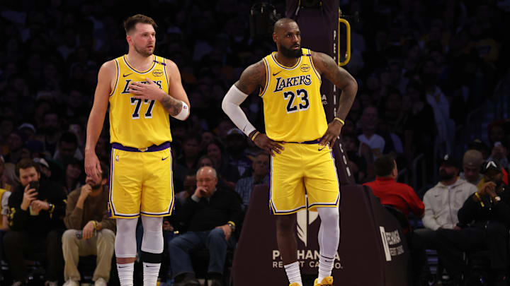 Feb 27, 2025; Los Angeles, California, USA; Los Angeles Lakers guard Luka Doncic (77) and forward LeBron James (23) during the second quarter against the Minnesota Timberwolves at Crypto.com Arena. Mandatory Credit: Jason Parkhurst-Imagn Images