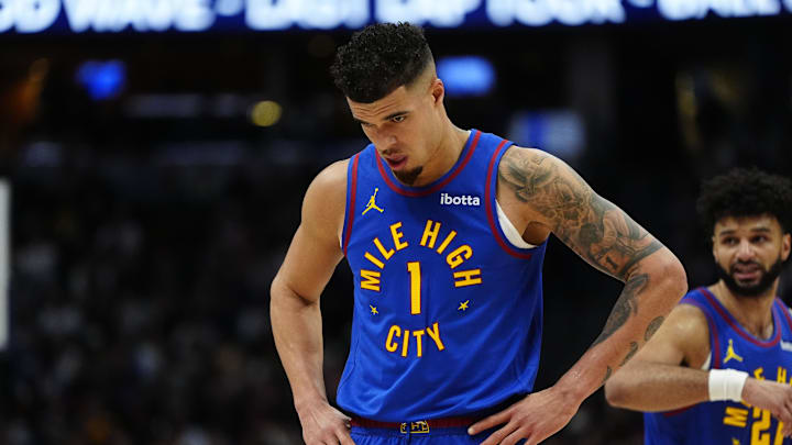 Jan 8, 2025; Denver, Colorado, USA; Denver Nuggets forward Michael Porter Jr. (1) heads to the bench in the second quarter against the LA Clippers at Ball Arena. Mandatory Credit: Ron Chenoy-Imagn Images