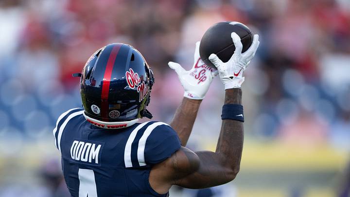 Sep 6, 2026; Nashville, Tennessee, USA;  Ole Miss Rebels tight end Caleb Odom (4) makes a catch against the Louisville Cardinals during pre-game warm-ups at Nissan Stadium. Mandatory Credit: Steve Roberts-Imagn Images
