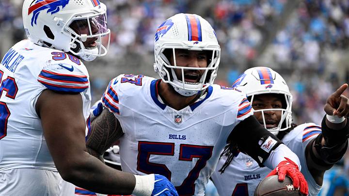 Oct 26, 2025; Charlotte, North Carolina, USA; Buffalo Bills defensive end AJ Epenesa (57) celebrates with guard Connor McGovern (66) and linebacker Dorian Williams (42) after intercepting a pass Oct 26, 2025; Charlotte, North Carolina, USA; Buffalo Bills defensive end AJ Epenesa (57) celebrates with guard Connor McGovern (66) and linebacker Dorian Williams (42) after intercepting a pass