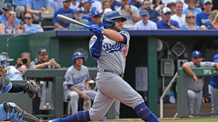 Jun 28, 2025; Kansas City, Missouri, USA;  Los Angeles Dodgers third baseman Max Muncy (13) singles in the third inning against the Kansas City Royals at Kauffman Stadium. Mandatory Credit: Peter Aiken-Imagn Images