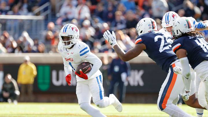 Nov 23, 2024; Charlottesville, Virginia, USA; SMU Mustangs running back Brashard Smith (1) carries the ball against the Virginia Cavaliers during the first half at Scott Stadium. Mandatory Credit: Amber Searls-Imagn Images Nov 23, 2024; Charlottesville, Virginia, USA; SMU Mustangs running back Brashard Smith (1) carries the ball against the Virginia Cavaliers during the first half at Scott Stadium. Mandatory Credit: Amber Searls-Imagn Images