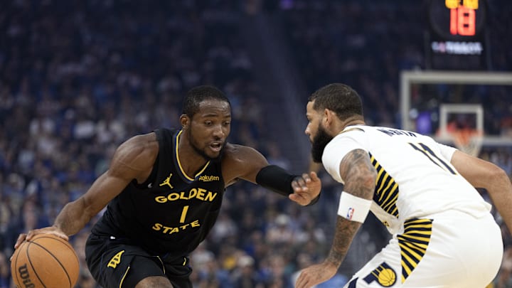 Nov 9, 2025; San Francisco, California, USA; Golden State Warriors forward Jonathan Kuminga (1) attempts to drive past Indiana Pacers forward Cody Martin (11) during the first quarter at Chase Center. Mandatory Credit: D. Ross Cameron-Imagn Images