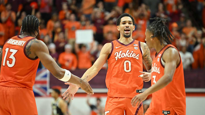 Feb 21, 2026; Blacksburg, Va.; Virginia Tech guard Jailen Bedford (0) is congratulated by forward Amani Hansberry (13) and guard Ben Hammond (3).