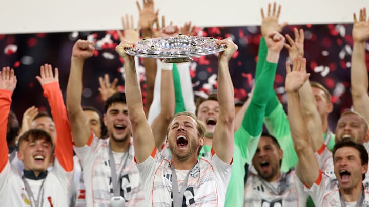 Bayern Munich players celebrating Bundesliga title against Borussia Monchengladbach.