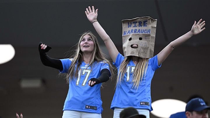 Jan 7, 2024; Inglewood, California, USA; Los Angeles Chargers fans look on from the stands wearing a