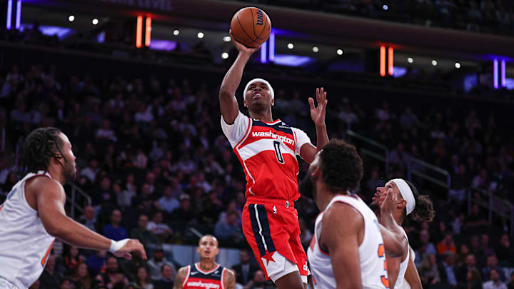 Oct 9, 2024; New York, New York, USA; Washington Wizards guard Bilal Coulibaly (0) shoots the ball as New York Knicks center Karl-Anthony Towns (32) defends during the first half at Madison Square Garden. Mandatory Credit: Vincent Carchietta-Imagn Images