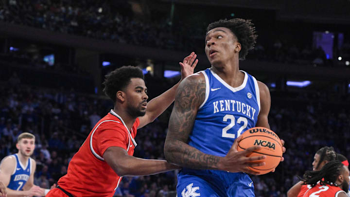 Dec 21, 2024; New York, New York, USA; Kentucky Wildcats center Amari Williams (22) posts up against Ohio State Buckeyes forward Sean Stewart (13) during the first half at Madison Square Garden. Mandatory Credit: John Jones-Imagn Images