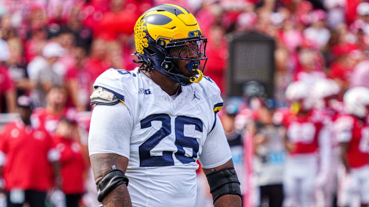 Sep 20, 2025; Lincoln, Nebraska, USA; Michigan Wolverines defensive lineman Rayshaun Benny (26) reacts after a sack against the Nebraska Cornhuskers during the second quarter at Memorial Stadium. Mandatory Credit: Dylan Widger-Imagn Images Sep 20, 2025; Lincoln, Nebraska, USA; Michigan Wolverines defensive lineman Rayshaun Benny (26) reacts after a sack against the Nebraska Cornhuskers during the second quarter at Memorial Stadium. Mandatory Credit: Dylan Widger-Imagn Images