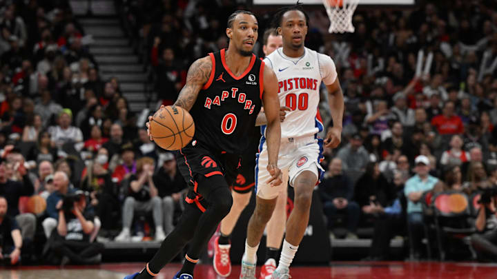 Apr 4, 2025; Toronto, Ontario, CAN;  Toronto Raptors guard AJ Lawson (0) dribbles the ball ahead of Detroit Pistons forward Ron Holland II ((00) in the second half at Scotiabank Arena. Mandatory Credit: Dan Hamilton-Imagn Images