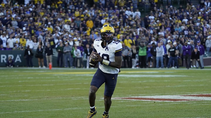 Nov 15, 2025; Chicago, Illinois, USA; Michigan Wolverines quarterback Bryce Underwood (19) runs with the ball against the Northwestern Wildcats during the second half at Wrigley Field. Mandatory Credit: David Banks-Imagn Images