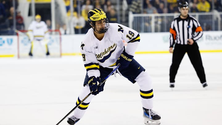 Mar 7, 2025; Ann Arbor, MI, USA;  Michigan Wolverines forward Michael Hage (19) skates with the puck against Penn State  during a Big Ten Tournament quarter final game at Yost Arena. Mandatory Credit: Rick Osentoski-Imagn Images