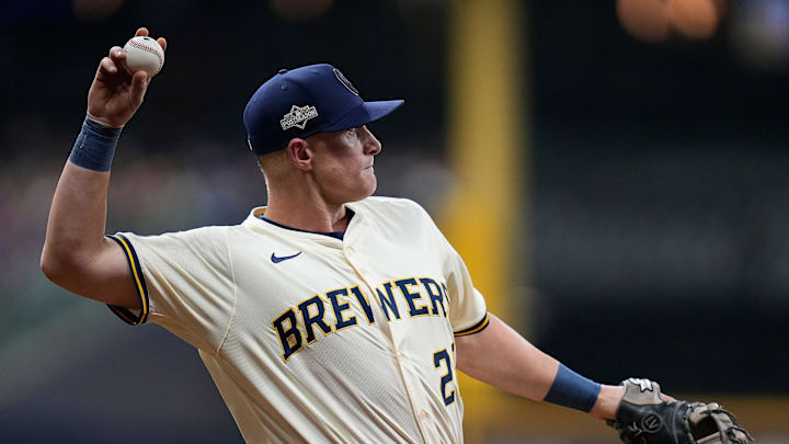 Los Angeles Dodgers second baseman Tommy Edman (25) grounds out to Milwaukee Brewers second baseman Brice Turang (2) during the second inning of the of their National League Championship Series game October 13, 2025 at American Family Field in Milwaukee, Wisconsin.
