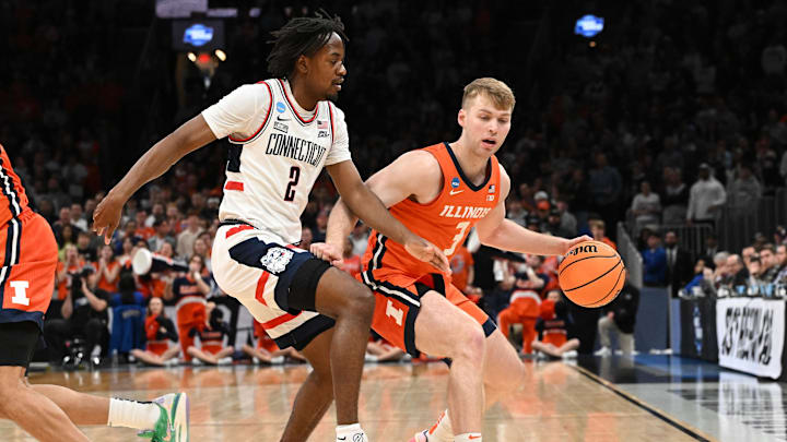 Mar 30, 2024; Boston, MA, USA; Illinois Fighting Illini forward Marcus Domask (3) dribbles the ball against Connecticut Huskies guard Tristen Newton (2) in the Elite Eight.