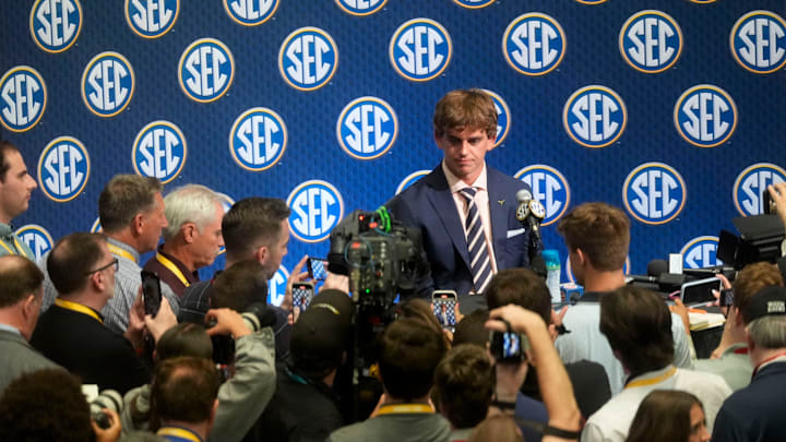 July 15, 2025; Atlanta, GA, USA; Texas quarterback Arch Manning is surrounded by media as he participates in SEC Media Days at the College Football Hall of Fame in Atlanta.